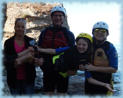 Family kayaking in the Pacific